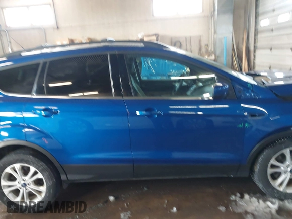 2018 Ford Escape SE z VIN 1FMCU9GD1JUB80500, wystawiony jako IAAI lot #41613294 z przebiegiem 112 187 mil mil oraz . Historia ofert i sprzedaży dostępna na DreamBid. Obrazek 13.