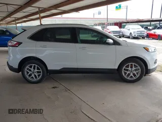 2021 Ford Edge SEL z VIN 2FMPK3J98MBA32220, wystawiony jako IAAI lot #41945825 z przebiegiem Nie podano mil oraz . Historia ofert i sprzedaży dostępna na DreamBid. Obrazek 13.