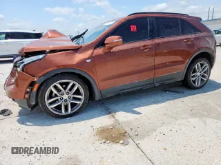 2019 Cadillac XT4 FWD Sport with VIN 1GYFZER42KF104499, listed as a Copart auction lot 58691615 with 96,545 mi miles and Salvage title. Bid and sale history available at DreamBid. Image 1.