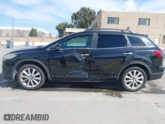 2015 Mazda CX-9 Grand Touring z VIN JM3TB2DA4F0450014, wystawiony jako IAAI lot #41692935 z przebiegiem 90 800 mil mil oraz . Historia ofert i sprzedaży dostępna na DreamBid. Obrazek 14.