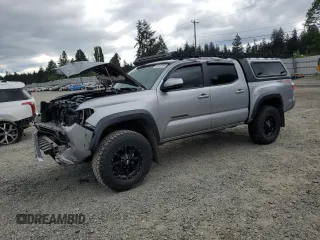 2021 Toyota Tacoma SR with VIN 3TMCZ5AN8MM405066, listed as a Copart auction lot 56010195 with 55,724 mi miles and Salvage title. Bid and sale history available at DreamBid. Image 1.