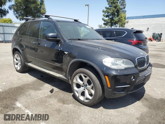 2012 BMW X5 35i z VIN 5UXZV4C51CL744313, wystawiony jako Copart lot #58270755 z przebiegiem 97 903 mil mil oraz Szkoda całkowita • Salvage title. Historia ofert i sprzedaży dostępna na DreamBid. Obrazek 4.