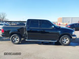 2002 Ford F-150 XLT with VIN 1FTRW07622KD31203, listed as a IAAI auction lot 41401506 with 166,949 mi miles. Bid and sale history available at carsss.com. Image 13.