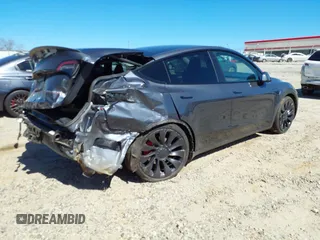 2022 Tesla Model Y Performance with VIN 7SAYGDEF9NF544205, listed as a IAAI auction lot 41825453 with 33,039 mi miles and . Bid and sale history available at DreamBid. Image 4.