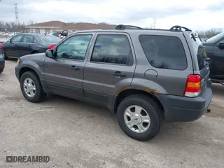2003 Ford Escape XLT Popular 2 with VIN 1FMYU93103KA39840, listed as a IAAI auction lot 41966605 with 141,321 mi miles. Bid and sale history available at carsss.com. Image 3.