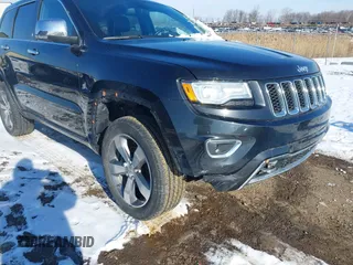 2015 Jeep Grand Cherokee Overland z VIN 1C4RJFCG3FC726748, wystawiony jako IAAI lot #41369715 z przebiegiem 120 905 mil mil oraz . Historia ofert i sprzedaży dostępna na DreamBid. Obrazek 6.