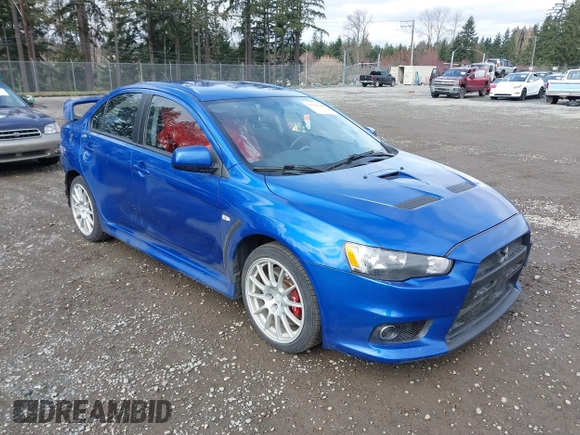 2015 Mitsubishi Lancer Evolution GSR with VIN JA32W8FV4FU012578, listed as a IAAI auction lot 41730742 with 64,762 mi miles. Bid and sale history available at carsss.com. Image 1.