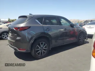 2018 Mazda CX-5 Grand Touring with VIN JM3KFADM3J1389911, listed as a Copart auction lot 60530295 with 103,177 mi miles and Salvage title. Bid and sale history available at DreamBid. Image 3.