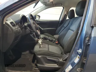 2015 Mazda CX-5 Sport with VIN JM3KE4BY9F0552942, listed as a Copart auction lot 54750245 with 129,700 mi miles and Salvage title. Bid and sale history available at DreamBid. Image 7.