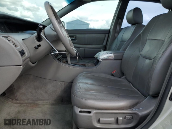 2000 Toyota Avalon XL with VIN 4T1BF28B3YU002835, listed as a Copart auction lot 50902115 with 128,699 mi miles and Salvage Title. Bid and sale history available at DreamBid. Image 7.