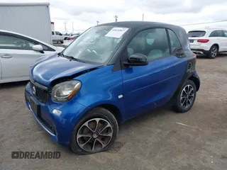 2016 Smart fortwo Passion z VIN WMEFJ5DA8GK059871, wystawiony jako IAAI lot #41624917 z przebiegiem 90 906 mil mil oraz . Historia ofert i sprzedaży dostępna na DreamBid. Obrazek 17.