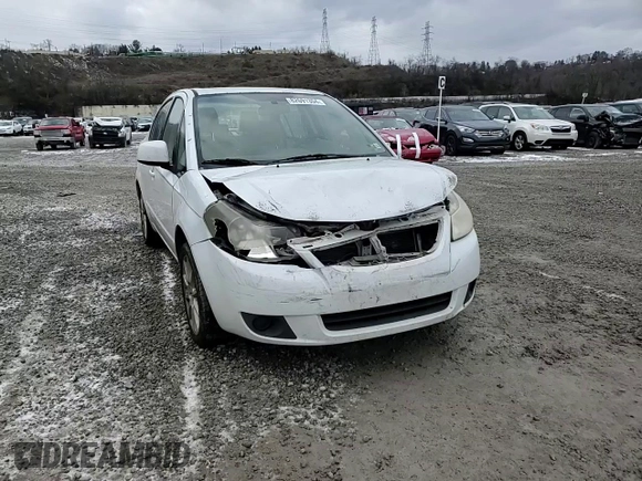 2011 Suzuki SX4 LE z VIN JS2YC5A29B6302397, wystawiony jako Copart lot #82691304 z przebiegiem 251 382 mil mil oraz Szkoda całkowita • Salvage title. Historia ofert i sprzedaży dostępna na DreamBid. Obrazek 11.