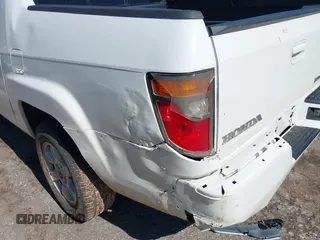 2006 Honda Ridgeline RTL with VIN 2HJYK16506H562857, listed as a IAAI auction lot 42169379 with 154,194 mi miles. Bid and sale history available at carsss.com. Image 6.