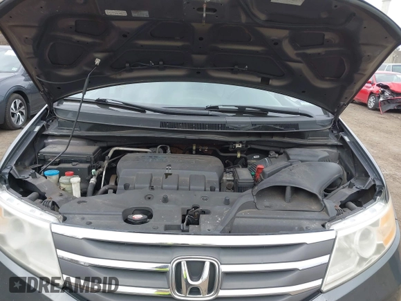 2012 Honda Odyssey EX-L with VIN 5FNRL5H65CB042898, listed as a IAAI auction lot 41784075 with 179,596 mi miles and . Bid and sale history available at carsss.com. Image 10.