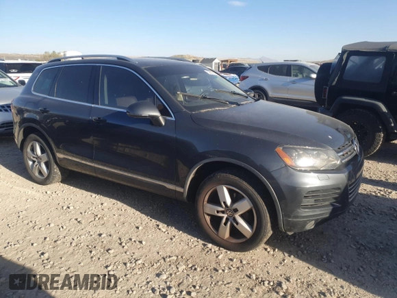 2012 Volkswagen Touareg Sport z VIN WVGFK9BP6CD001309, wystawiony jako Copart lot #52827875 z przebiegiem 153 250 mil mil oraz Czysty tytuł • Clean title. Historia ofert i sprzedaży dostępna na DreamBid. Obrazek 4.