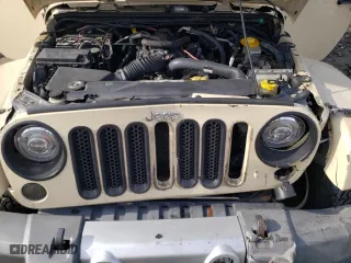 2011 Jeep Wrangler Unlimited Sahara with VIN 1J4BA5H19BL593658, listed as a Copart auction lot 71947684 with 122,323 mi miles and Salvage Title. Bid and sale history available at carsss.com. Image 12.