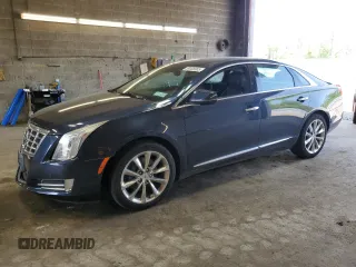 2013 Cadillac XTS Luxury z VIN 2G61P5S31D9140707, wystawiony jako Copart lot #59008905 z przebiegiem 93 427 mil mil oraz Szkoda całkowita • Salvage title. Historia ofert i sprzedaży dostępna na DreamBid. Obrazek 1.
