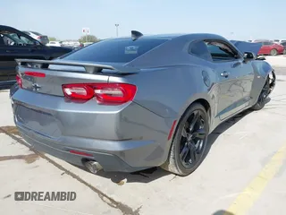 2021 Chevrolet Camaro 1LT z VIN 1G1FB1RX9M0125698, wystawiony jako IAAI lot #41824653 z przebiegiem 69 365 mil mil oraz . Historia ofert i sprzedaży dostępna na DreamBid. Obrazek 4.