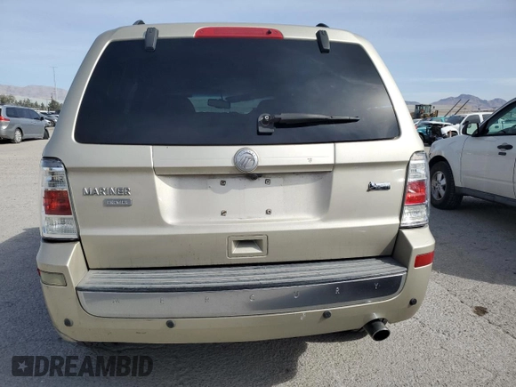 2010 Mercury Mariner Premier z VIN 4M2CN8HG0AKJ00727, wystawiony jako Copart lot #51244455 z przebiegiem 125 675 mil mil oraz Szkoda całkowita • Salvage title. Historia ofert i sprzedaży dostępna na DreamBid. Obrazek 6.