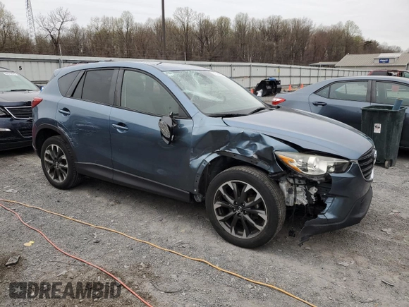 2016 Mazda CX-5 Grand Touring with VIN JM3KE4DY7G0761594, listed as a Copart auction lot 51514595 with 58,250 mi miles and Salvage Title. Bid and sale history available at DreamBid. Image 4.