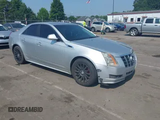 2012 Cadillac CTS with VIN 1G6DC5E51C0156873, listed as a IAAI auction lot 42587421 with 169,006 mi miles and . Bid and sale history available at DreamBid. Image 1.