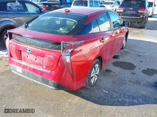 2018 Toyota Prius Two with VIN JTDKARFU5J3055838, listed as a IAAI auction lot 41259424 with 87,056 mi miles. Bid and sale history available at carsss.com. Image 4.