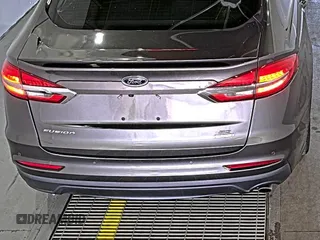 2020 Ford Fusion SE z VIN 3FA6P0HD6LR189762, wystawiony jako IAAI lot #42780149 z przebiegiem 51 099 mil mil oraz . Historia ofert i sprzedaży dostępna na DreamBid. Obrazek 23.