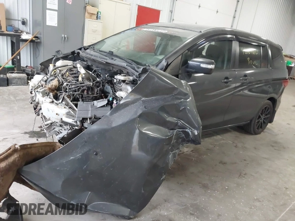 2014 Mazda 5 Sport z VIN JM1CW2BLXE0164748, wystawiony jako IAAI lot #42064606 z przebiegiem 140 169 mil mil oraz . Historia ofert i sprzedaży dostępna na DreamBid. Obrazek 17.