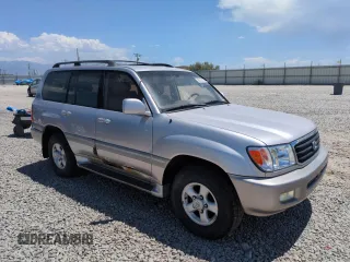 2000 Toyota Land Cruiser z VIN JT3HT05J5Y0118136, wystawiony jako Copart lot #60333115 z przebiegiem 184 284 mil mil oraz Czysty tytuł • Clean title. Historia ofert i sprzedaży dostępna na DreamBid. Obrazek 4.
