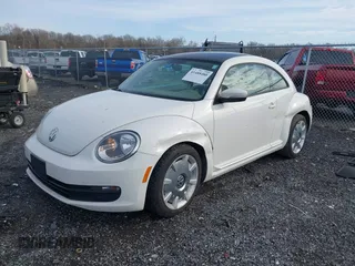 2014 Volkswagen Beetle 2.5L w/Sun with VIN 3VWJP7AT8EM611560, listed as a IAAI auction lot 41488488 with 140,798 mi miles and . Bid and sale history available at DreamBid. Image 18.