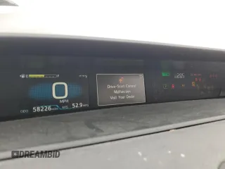 2021 Toyota Prius L Eco z VIN JTDKAMFU2M3148890, wystawiony jako Copart lot #60064065 z przebiegiem 58 226 mil mil oraz Szkoda całkowita • Salvage title. Historia ofert i sprzedaży dostępna na DreamBid. Obrazek 9.