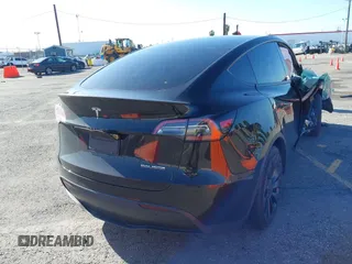 2022 Tesla Model Y Performance with VIN 7SAYGDEF5NF336693, listed as a IAAI auction lot 41805752 with 42,009 mi miles and . Bid and sale history available at DreamBid. Image 4.
