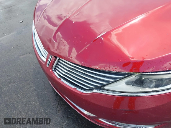 2015 Lincoln MKZ z VIN 3LN6L2GK8FR616005, wystawiony jako IAAI lot #42804770 z przebiegiem 241 352 mil mil oraz . Historia ofert i sprzedaży dostępna na DreamBid. Obrazek 13.