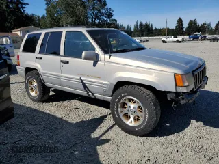 1997 Jeep Grand Cherokee Limited with VIN 1J4GZ78Y5VC598822, listed as a Copart auction lot 74306474 with 276,454 mi miles and Salvage Title. Bid and sale history available at carsss.com. Image 4.