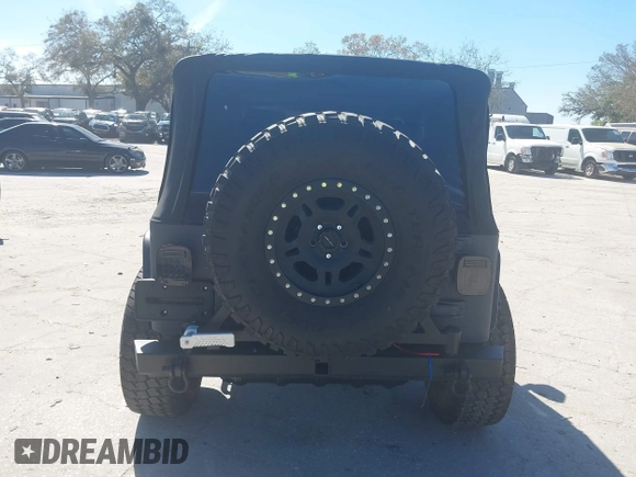 2003 Jeep Wrangler X with VIN 1J4FA39S03P314685, listed as a IAAI auction lot 41649741 with 119,924 mi miles. Bid and sale history available at carsss.com. Image 17.