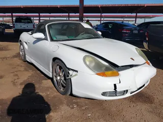 2002 Porsche Boxster S z VIN WP0CB29842U663188, wystawiony jako IAAI lot #41321243 z przebiegiem 129 095 mil mil oraz . Historia ofert i sprzedaży dostępna na DreamBid. Obrazek 1.