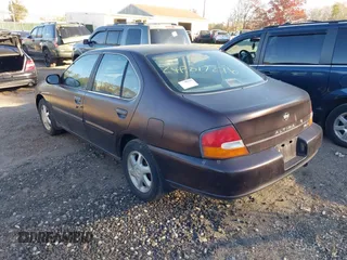 1999 Nissan Altima XE with VIN 1N4DL01D1XC193705, listed as a IAAI auction lot 40880059 with 183,605 mi miles. Bid and sale history available at carsss.com. Image 3.