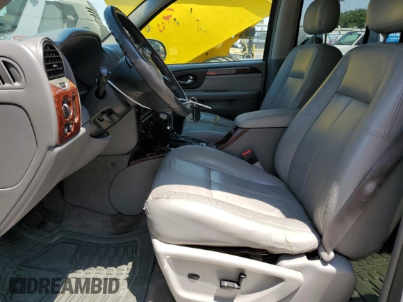 2006 GMC Envoy SLE z VIN 1GKDT13S762345183, wystawiony jako Copart lot #60096645 z przebiegiem 249 658 mil mil oraz Szkoda całkowita • Salvage title. Historia ofert i sprzedaży dostępna na DreamBid. Obrazek 7.