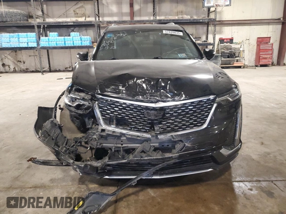 2020 Cadillac XT6 FWD Premium Luxury with VIN 1GYKPCRSXLZ154638, listed as a Copart auction lot 57439835 with 142,435 mi miles and Salvage title. Bid and sale history available at DreamBid. Image 5.