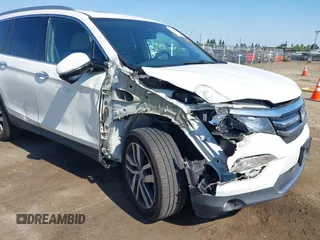 2018 Honda Pilot Touring with VIN 5FNYF6H95JB019122, listed as a IAAI auction lot 42439283 with 128,848 mi miles and . Bid and sale history available at DreamBid. Image 6.