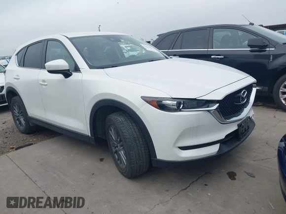 2017 Mazda CX-5 Touring z VIN JM3KFBCL5H0128584, wystawiony jako IAAI lot #42354669 z przebiegiem 56 563 mil mil oraz . Historia ofert i sprzedaży dostępna na DreamBid. Obrazek 1.