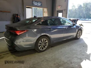 2020 Toyota Avalon Hybrid XLE z VIN 4T1A21FB7LU014807, wystawiony jako Copart lot #38368943 z przebiegiem 40 015 mil mil oraz . Historia ofert i sprzedaży dostępna na DreamBid. Obrazek 3.