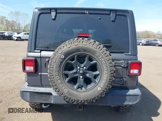 2021 Jeep Wrangler Unlimited Willys with VIN 1C4HJXDG1MW672507, listed as a IAAI auction lot 42084805 with 59,943 mi miles and . Bid and sale history available at DreamBid. Image 16.