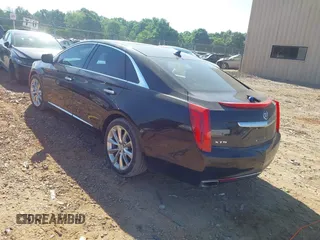 2014 Cadillac XTS Luxury z VIN 2G61M5S30E9229758, wystawiony jako IAAI lot #42179952 z przebiegiem 125 848 mil mil oraz . Historia ofert i sprzedaży dostępna na DreamBid. Obrazek 3.
