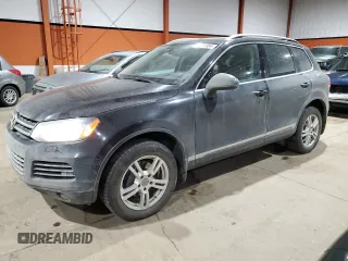 2013 Volkswagen Touareg Sport с VIN WVGEP9BP5DD008301, выставлен на аукционе Copart как лот 85085984 с пробегом 204 735 миль миль и Списание • Salvage title. История ставок и продаж доступна на DreamBid. Изображение 1.