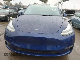 2022 Tesla Model Y Long Range with VIN 7SAYGDEE8NF511395, listed as a IAAI auction lot 41595310 with 65,156 mi miles and . Bid and sale history available at carsss.com. Image 12.