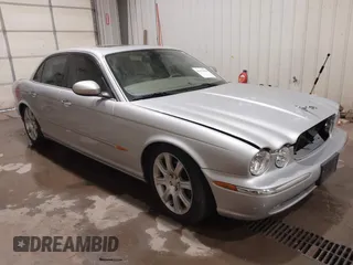 2004 Jaguar XJ with VIN SAJWA71C04SG33993, listed as a IAAI auction lot 41193040 with 79,944 mi miles. Bid and sale history available at carsss.com. Image 1.