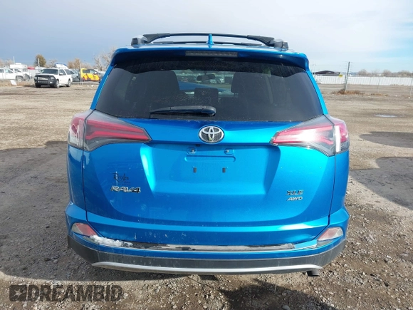 2016 Toyota RAV4 XLE with VIN JTMRFREV4GD186580, listed as a IAAI auction lot 40916703 with 117,120 mi miles and . Bid and sale history available at DreamBid. Image 16.