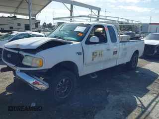 2002 Ford F-150 XL with VIN 1FTRX17L82NA54581, listed as a IAAI auction lot 41698662 with 220,321 mi miles. Bid and sale history available at carsss.com. Image 17.