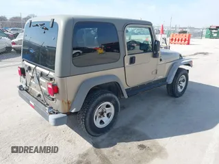 2006 Jeep Wrangler Sport Right Hand Drive with VIN 1J4F449S46P716520, listed as a IAAI auction lot 41763887 with 236,816 mi miles. Bid and sale history available at carsss.com. Image 4.